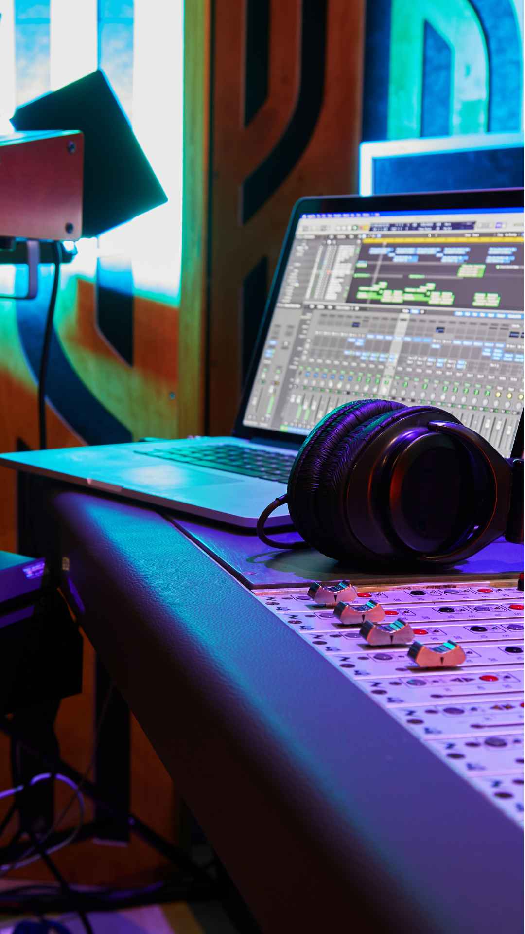 Toronto-based music production studio setup with digital audio workstation, mixing console, keyboard, and headphones — powered by custom PCs from OrdinaryTech